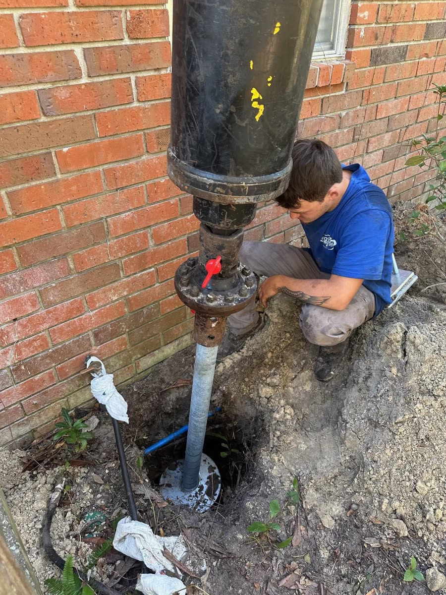 Helical pier installation at a residential foundation