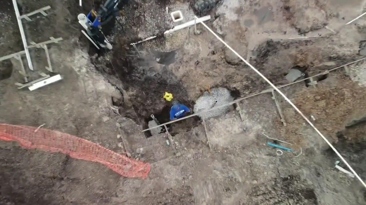 Solid Foundations crew excavating for a foundation pier installation