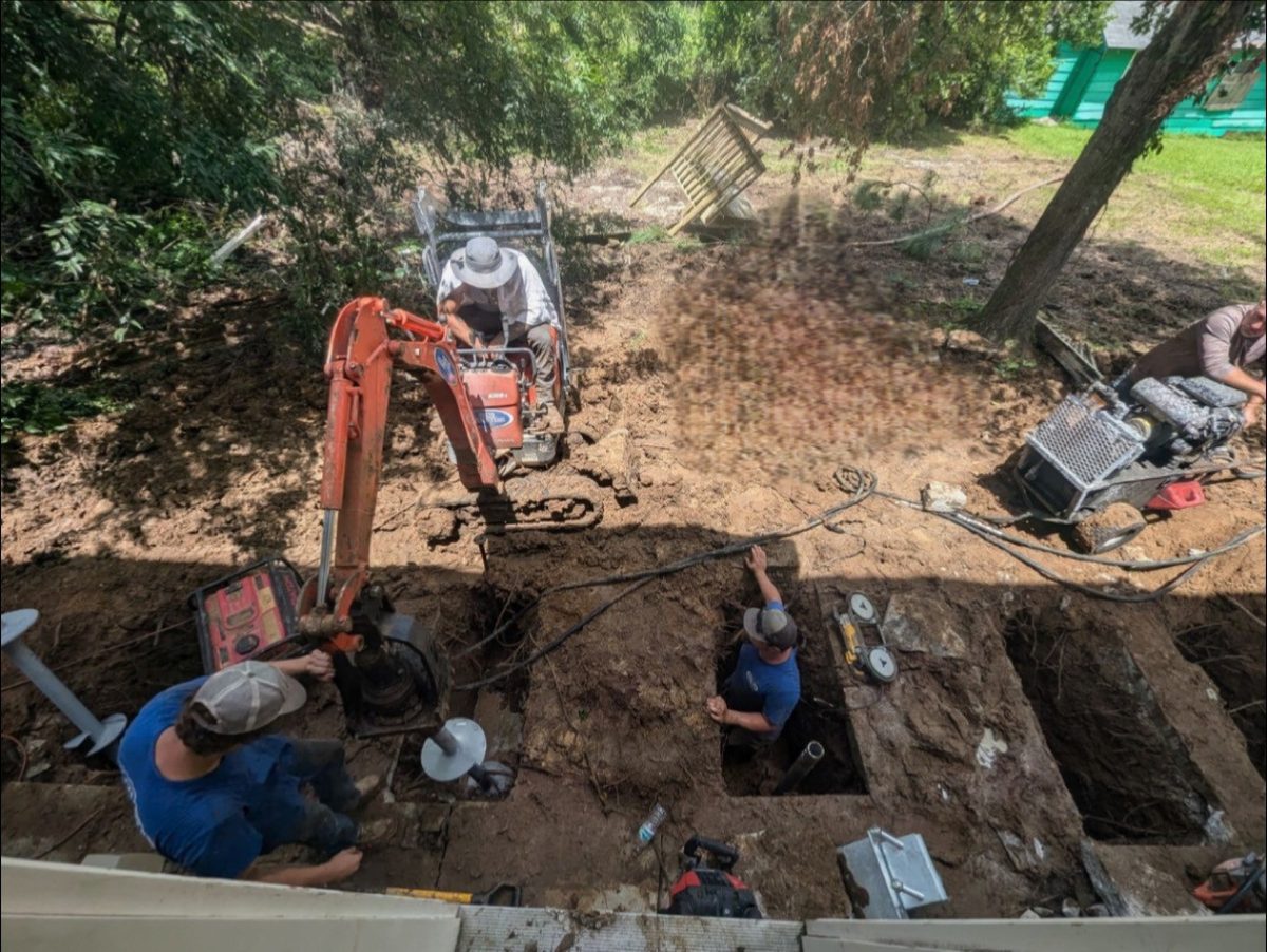 Helical pier installation equipment on a foundation repair job