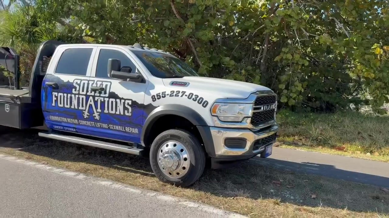 Solid Foundations truck arriving at a foundation repair job site