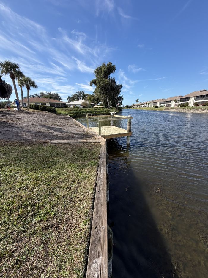 Completed seawall and dock along a Florida canal
