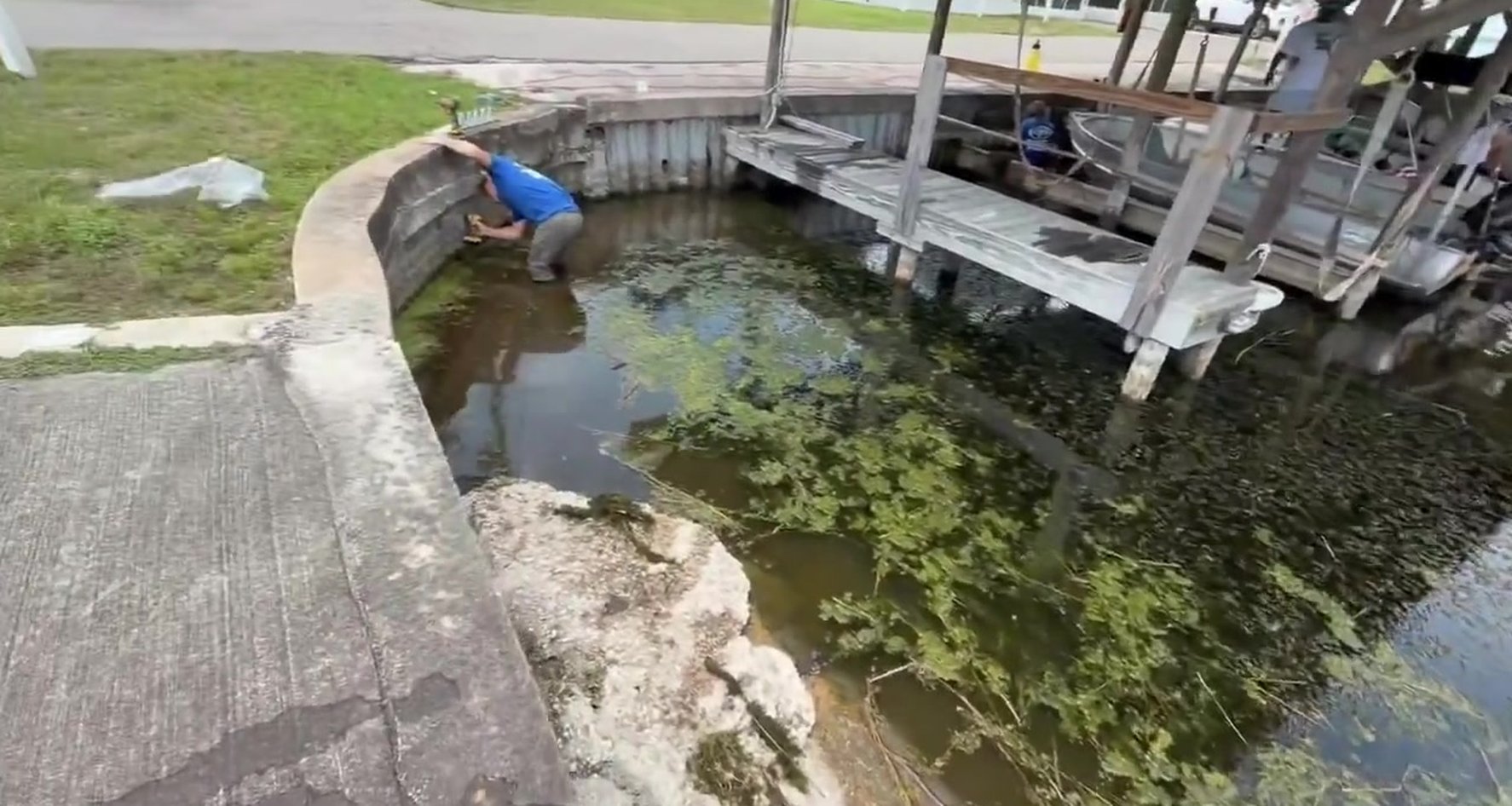 Solid Foundations truck parked beside a finished seawall along a Florida canal