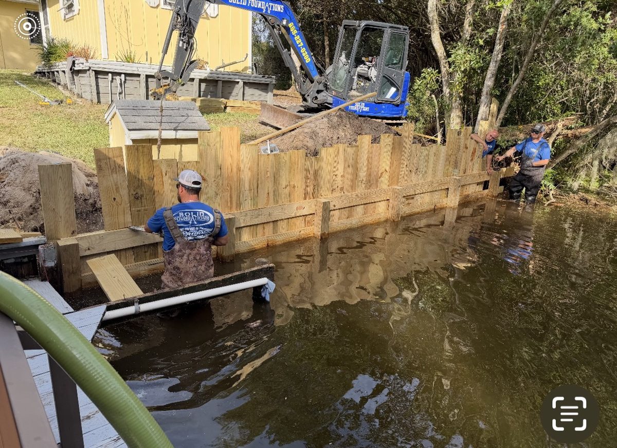 Solid Foundations crew and equipment building a new seawall bulkhead on a Florida waterway