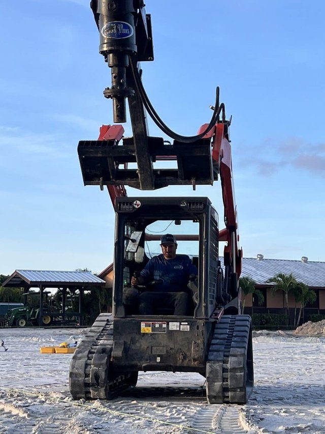 Excavator digging on a Solid Foundations jobsite