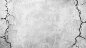 give me a background for a website section in light grey color and it has cracks in it. on the sides.